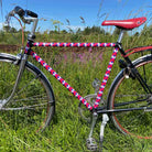 mooxibike-fahrradfolie-rauten-bunt-rennrad-grass-zaun-natur